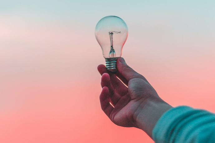 person holding light bulb